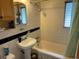 Clean bathroom with a bathtub, sink, and shower at 5322 8Th S Ave, Gulfport, FL 33707