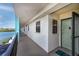 Exterior view of a walkway, showing the apartment door on the condo complex's exterior at 19531 Gulf Blvd # 403, Indian Shores, FL 33785