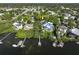 Aerial view of waterfront home with private dock and lush landscaping at 761 Soundview Dr, Palm Harbor, FL 34683