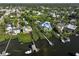 Aerial view of waterfront homes and properties with private docks at 761 Soundview Dr, Palm Harbor, FL 34683