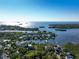 Wide aerial showcasing waterfront homes and lush landscaping at 761 Soundview Dr, Palm Harbor, FL 34683