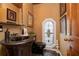 Powder room with pedestal sink and unique window at 761 Soundview Dr, Palm Harbor, FL 34683