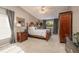 Serene bedroom with carpeted floors, large windows, and ample closet space at 761 Soundview Dr, Palm Harbor, FL 34683