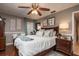 Comfortable bedroom featuring a ceiling fan, neutral paint and hardwood floors at 761 Soundview Dr, Palm Harbor, FL 34683