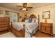 Bedroom with wood floors and ceiling fan at 761 Soundview Dr, Palm Harbor, FL 34683