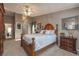 Cozy bedroom featuring a decorative ceiling fan, neutral paint and carpet at 761 Soundview Dr, Palm Harbor, FL 34683