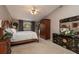 Relaxing bedroom with carpeted floors, a ceiling fan, and built-in wardrobe at 761 Soundview Dr, Palm Harbor, FL 34683
