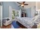 Serene bedroom with a king-size bed and private balcony access at 761 Soundview Dr, Palm Harbor, FL 34683