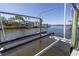 Private boat lift on a waterfront property with homes nearby at 761 Soundview Dr, Palm Harbor, FL 34683