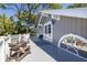 Spacious deck with seating area, offering access to the home and scenic views at 761 Soundview Dr, Palm Harbor, FL 34683