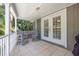 Peaceful deck with two adirondack chairs and access to interior at 761 Soundview Dr, Palm Harbor, FL 34683