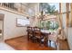 Elegant dining room with decorative wallpaper, hard wood floors, and large bay window at 761 Soundview Dr, Palm Harbor, FL 34683