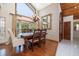 Formal dining room with decorative wallpaper, wood floors, and large bay window at 761 Soundview Dr, Palm Harbor, FL 34683
