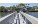 Private dock extending into the water with white railings at 761 Soundview Dr, Palm Harbor, FL 34683