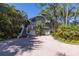 Two-story home with a large driveway and mature landscaping at 761 Soundview Dr, Palm Harbor, FL 34683
