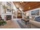 Inviting living room featuring a fireplace, high ceilings, and hardwood accents at 761 Soundview Dr, Palm Harbor, FL 34683