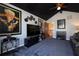 Relaxing media room with large TV, comfortable seating, and home theater at 761 Soundview Dr, Palm Harbor, FL 34683
