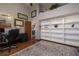 Spacious home office with built-in shelving and hardwood floors at 761 Soundview Dr, Palm Harbor, FL 34683