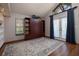 Home office with built-in shelving and hardwood floors at 761 Soundview Dr, Palm Harbor, FL 34683