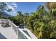 Inviting pool and spa surrounded by lush tropical landscaping at 761 Soundview Dr, Palm Harbor, FL 34683