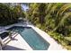 Relaxing pool and spa area with lush tropical landscaping at 761 Soundview Dr, Palm Harbor, FL 34683