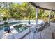 Spacious pool and spa with comfortable seating at 761 Soundview Dr, Palm Harbor, FL 34683