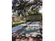 Outdoor shuffleboard courts shaded by lush trees at 2101 Sunset Point Rd # 1001, Clearwater, FL 33765