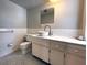 Clean bathroom with white vanity, toilet, and updated sink at 2101 Sunset Point Rd # 1001, Clearwater, FL 33765