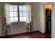 Bedroom with large window and adjacent bathroom at 2101 Sunset Point Rd # 1001, Clearwater, FL 33765