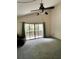 Living room with sliding doors to a balcony at 2101 Sunset Point Rd # 1001, Clearwater, FL 33765