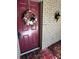 Inviting front door adorned with a beautiful wreath at 2101 Sunset Point Rd # 1001, Clearwater, FL 33765