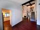Open concept living room with view of kitchen and staircase at 2101 Sunset Point Rd # 1001, Clearwater, FL 33765