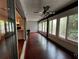 Sunroom with wood floors and view of nature at 2101 Sunset Point Rd # 1001, Clearwater, FL 33765