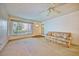 Living area featuring a sofa and access to the front door at 2431 Canadian Way # 9, Clearwater, FL 33763