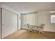 Small dining area with table and chairs near a window at 2431 Canadian Way # 9, Clearwater, FL 33763