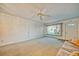 Living room with ceiling fan and access to front door at 2431 Canadian Way # 9, Clearwater, FL 33763