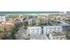 Aerial view of a coastal community featuring beach and multiple buildings at 11605 1St E St # 6, Treasure Island, FL 33706
