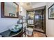 Elegant bathroom boasting a marble shower, unique vessel sink, and decorative accents at 213 46Th Ave, St Pete Beach, FL 33706