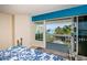 Bedroom with sliding glass door leading to balcony and water view at 213 46Th Ave, St Pete Beach, FL 33706