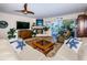 Spacious living room with hardwood floors, comfortable seating, and fireplace at 213 46Th Ave, St Pete Beach, FL 33706