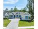 Beautiful one-story home boasting a manicured lawn and a stylish driveway and a covered porch at 4780 Majestic Hills Loop, Brooksville, FL 34601