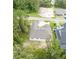 New construction home with gray roof, nestled in a wooded neighborhood at 4780 Majestic Hills Loop, Brooksville, FL 34601