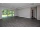 Spacious living area with sliding glass doors leading to backyard at 4780 Majestic Hills Loop, Brooksville, FL 34601