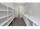 Walk-in pantry with white shelves and quartz countertop at 4780 Majestic Hills Loop, Brooksville, FL 34601