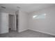 Bedroom with carpet flooring and large windows at 4780 Majestic Hills Loop, Brooksville, FL 34601
