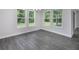Bright dining room with hardwood floors and large windows at 4780 Majestic Hills Loop, Brooksville, FL 34601