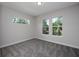Bedroom with carpet flooring and large windows at 4780 Majestic Hills Loop, Brooksville, FL 34601