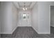 Spacious entryway with gray flooring and a light-colored door at 4780 Majestic Hills Loop, Brooksville, FL 34601