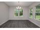 Bright dining room with hardwood floors and large windows at 4780 Majestic Hills Loop, Brooksville, FL 34601