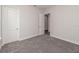 Bright bedroom featuring gray carpet and neutral walls at 4780 Majestic Hills Loop, Brooksville, FL 34601